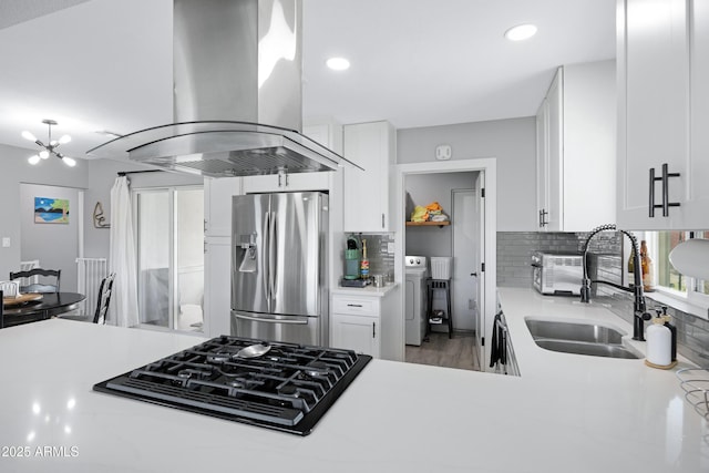 1615 E Roma Ave, Phoenix, AZ 85016 - kitchen with stainless steel fridge with ice dispenser, island exhaust hood, black cooktop, a sink, and light countertops