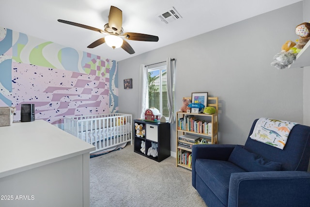 1615 E Roma Ave, Phoenix, AZ 85016 - carpeted bedroom featuring a nursery area and a ceiling fan