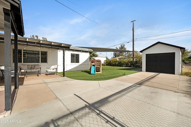 1615 E Roma Ave, Phoenix, AZ 85016 - view of patio / terrace featuring a playground, a detached garage, an outdoor living space, and an outdoor structure