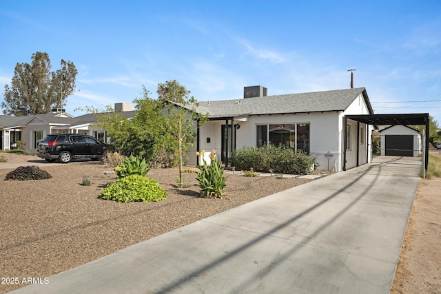 1615 E Roma Ave, Phoenix, AZ 85016 - view of front of property with concrete driveway, stucco siding, a carport, roof with shingles, and a garage