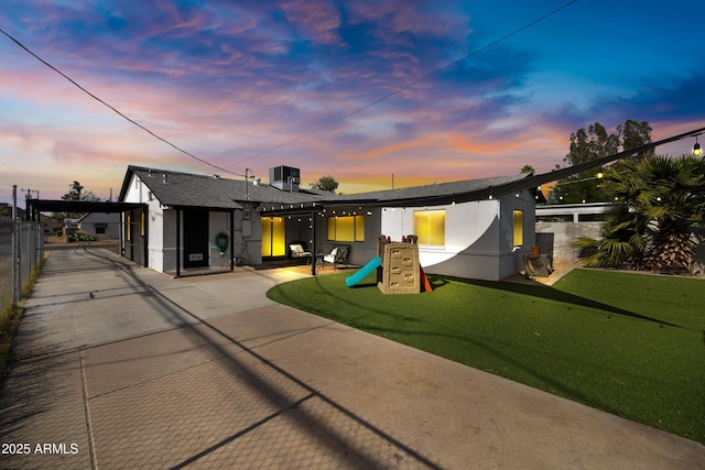 1615 E Roma Ave, Phoenix, AZ 85016 - back of property featuring fence, a patio, central air condition unit, and stucco siding