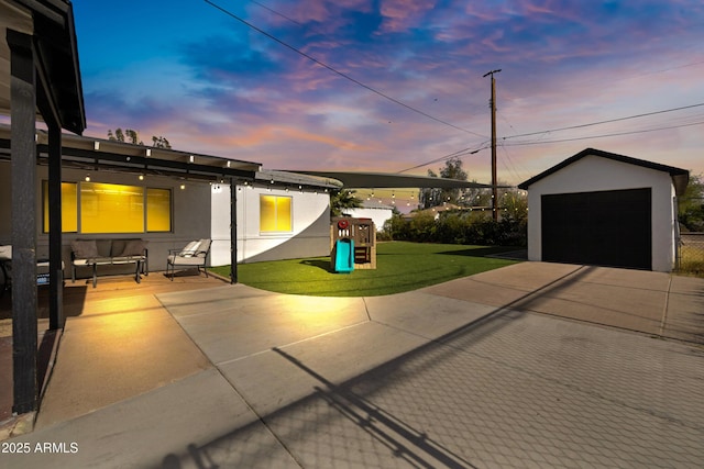 1615 E Roma Ave, Phoenix, AZ 85016 - view of patio with a garage, an outdoor structure, and a playground