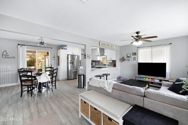 1615 E Roma Ave, Phoenix, AZ 85016 - living area featuring ceiling fan, light wood-type flooring, and baseboards