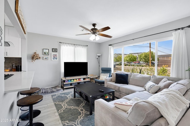 1615 E Roma Ave, Phoenix, AZ 85016 - living area featuring light wood-type flooring and a ceiling fan