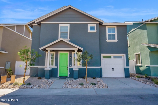 traditional-style home with driveway, stucco siding, and an attached garage