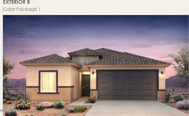 5029 S 252nd Ave, Buckeye, AZ 85326 - mediterranean / spanish house featuring concrete driveway, an attached garage, stucco siding, and a tiled roof