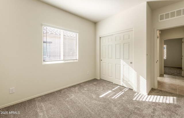 5029 S 252nd Ave, Buckeye, AZ 85326 - unfurnished bedroom featuring carpet floors, a closet, and baseboards