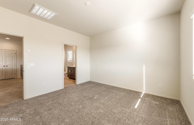 5029 S 252nd Ave, Buckeye, AZ 85326 - empty room with light colored carpet, baseboards, and recessed lighting