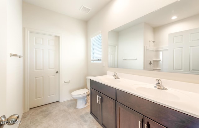 5029 S 252nd Ave, Buckeye, AZ 85326 - bathroom featuring double vanity, toilet, tile patterned flooring, a shower, and baseboards