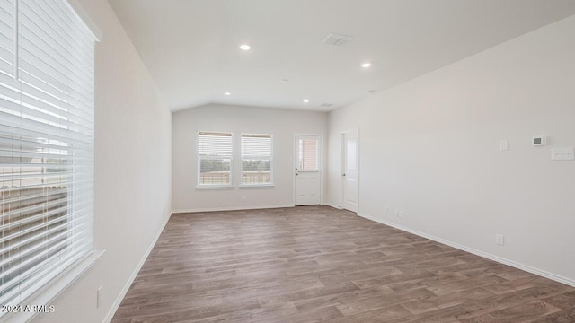 9507 S Mara Dr, Apache Junction, AZ 85120 - empty room featuring wood finished floors, recessed lighting, and vaulted ceiling