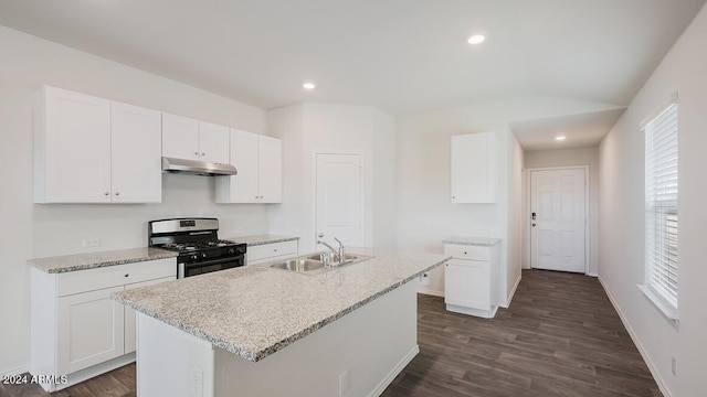 9507 S Mara Dr, Apache Junction, AZ 85120 - kitchen with range with gas stovetop, under cabinet range hood, dark wood finished floors, white cabinets, and recessed lighting