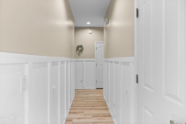 corridor featuring light hardwood / wood-style floors