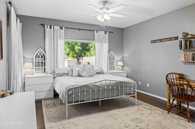 bedroom featuring ceiling fan and dark hardwood / wood-style floors