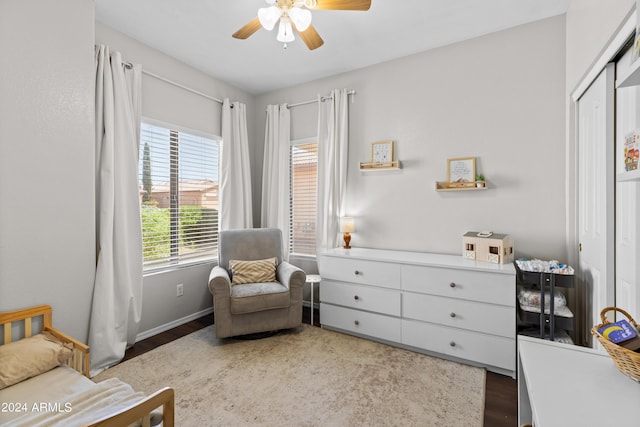 living area with hardwood / wood-style flooring and ceiling fan