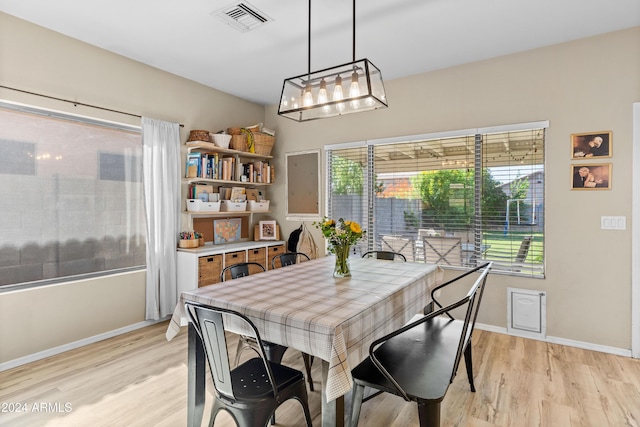 dining space featuring light hardwood / wood-style flooring