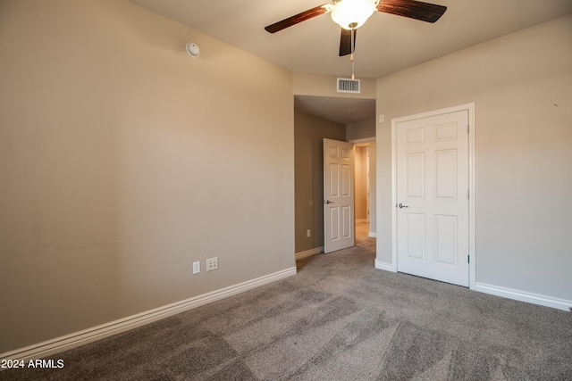 carpeted empty room with ceiling fan