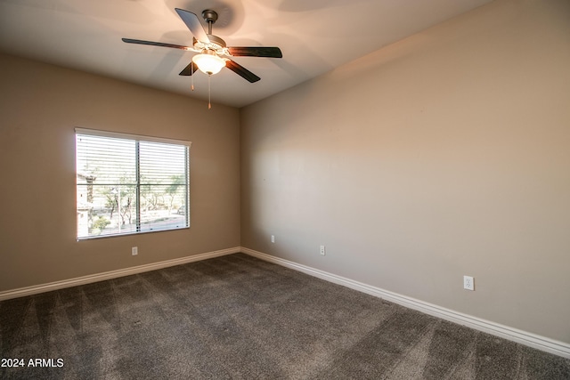 carpeted empty room featuring ceiling fan