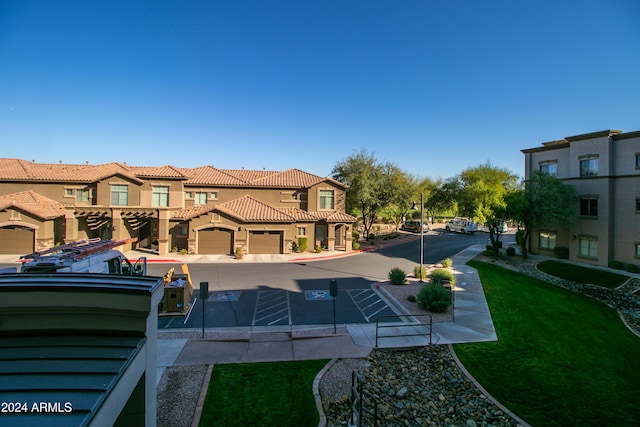 exterior space with a lawn and a garage