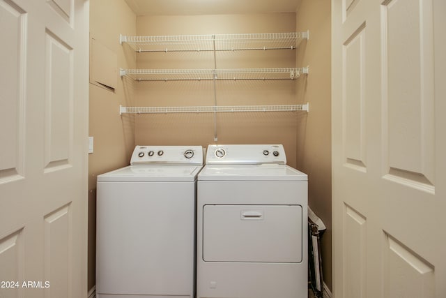 laundry area featuring washing machine and clothes dryer