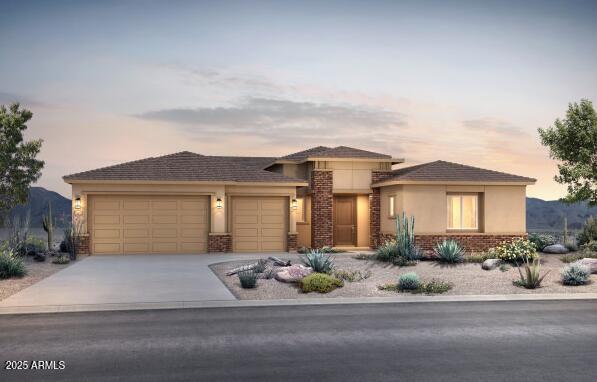 22660 E Pegasus Pkwy, Queen Creek, AZ 85142 - prairie-style house with an attached garage, stucco siding, and concrete driveway