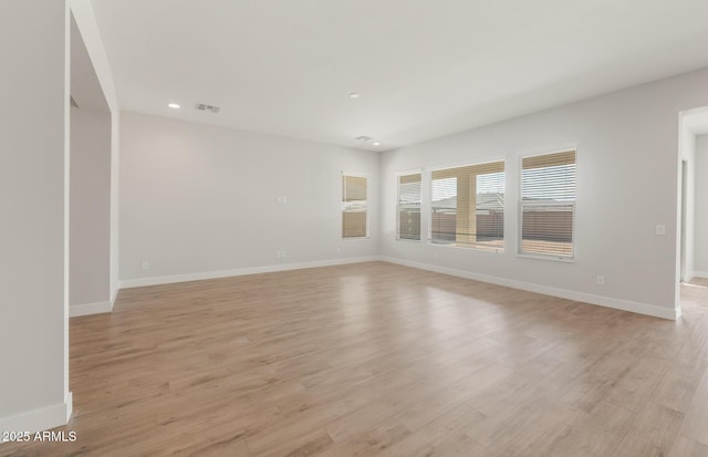 22660 E Pegasus Pkwy, Queen Creek, AZ 85142 - empty room with recessed lighting, light wood-style flooring, and baseboards