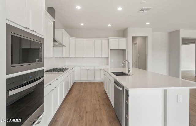 22660 E Pegasus Pkwy, Queen Creek, AZ 85142 - kitchen featuring stainless steel appliances, a sink, light wood-type flooring, white cabinetry, and recessed lighting
