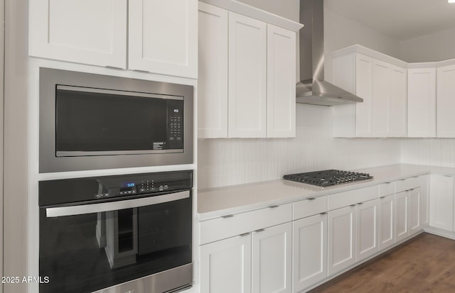 22660 E Pegasus Pkwy, Queen Creek, AZ 85142 - kitchen with wall chimney exhaust hood, stainless steel appliances, white cabinets, and light countertops