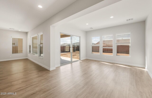 22660 E Pegasus Pkwy, Queen Creek, AZ 85142 - empty room featuring baseboards, recessed lighting, and light wood-style floors