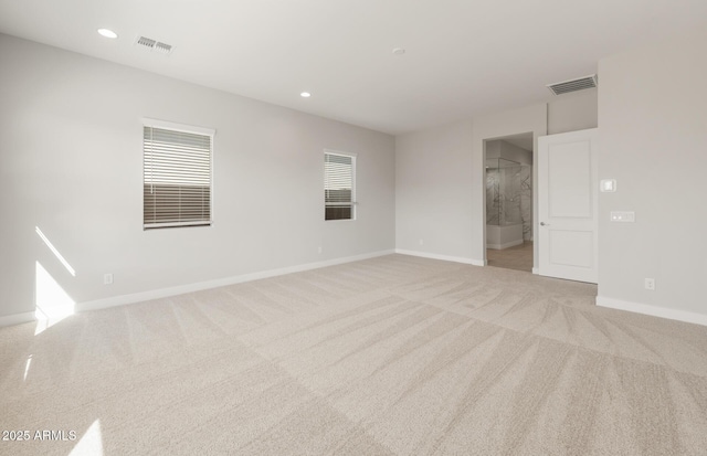22660 E Pegasus Pkwy, Queen Creek, AZ 85142 - spare room featuring light colored carpet, baseboards, and recessed lighting