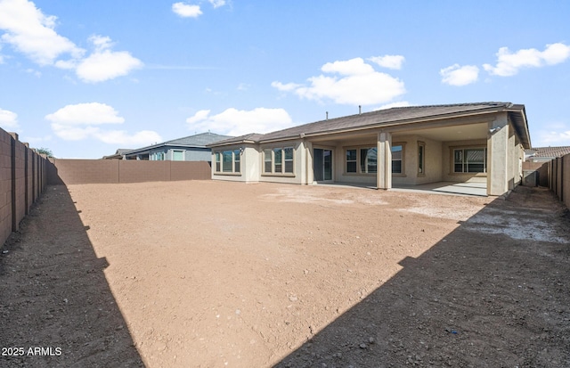 22660 E Pegasus Pkwy, Queen Creek, AZ 85142 - rear view of property with a fenced backyard, a patio, and stucco siding