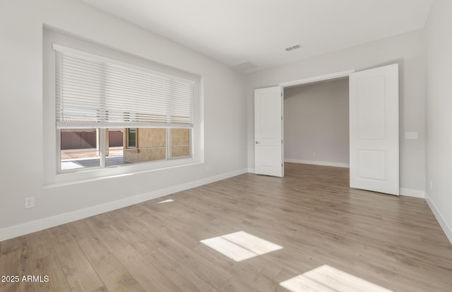 22660 E Pegasus Pkwy, Queen Creek, AZ 85142 - unfurnished bedroom with wood finished floors and baseboards