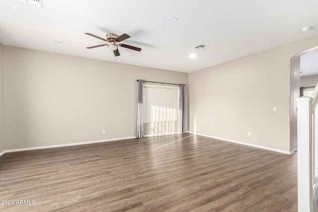 unfurnished room with hardwood / wood-style flooring and ceiling fan