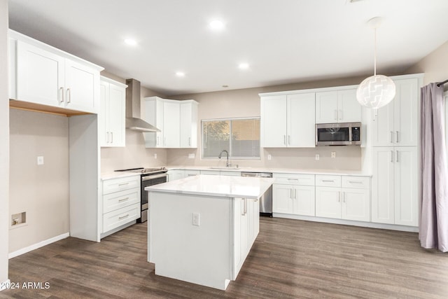 20293 N 83rd Dr, Peoria, AZ 85382 - kitchen featuring a center island, white cabinetry, stainless steel appliances, wall chimney exhaust hood, and dark wood-type flooring