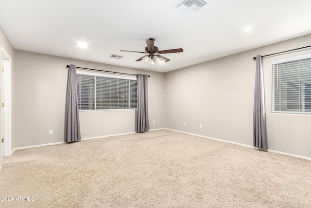 carpeted empty room with ceiling fan