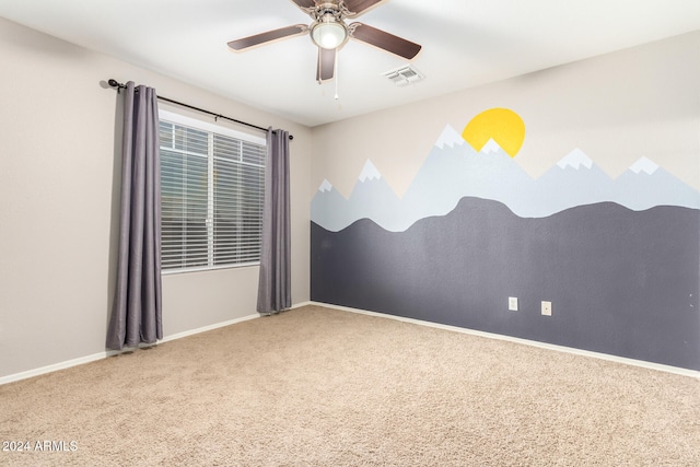 carpeted empty room with ceiling fan