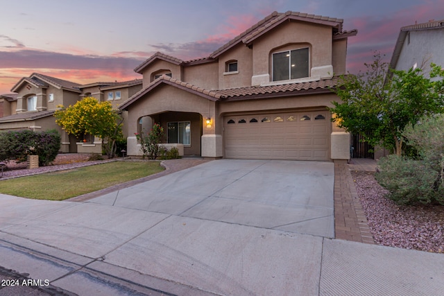 mediterranean / spanish-style home featuring a garage