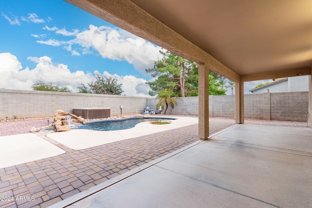 view of patio / terrace featuring central air condition unit and a fenced in pool