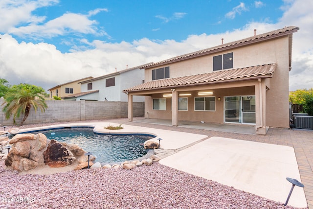 view of pool with a patio area and central AC