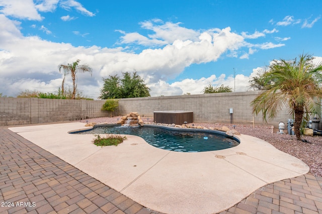 view of swimming pool featuring a patio, pool water feature, and central AC