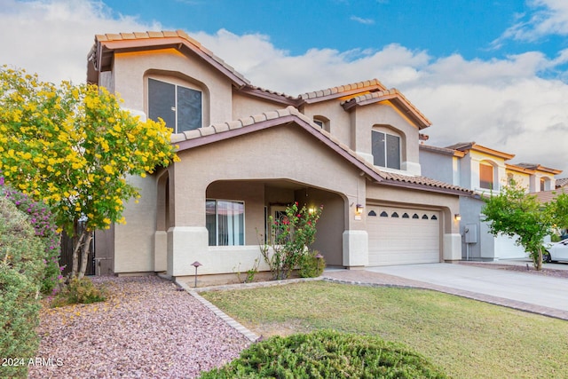 20293 N 83rd Dr, Peoria, AZ 85382 - mediterranean / spanish-style home with stucco siding, driveway, and a tile roof