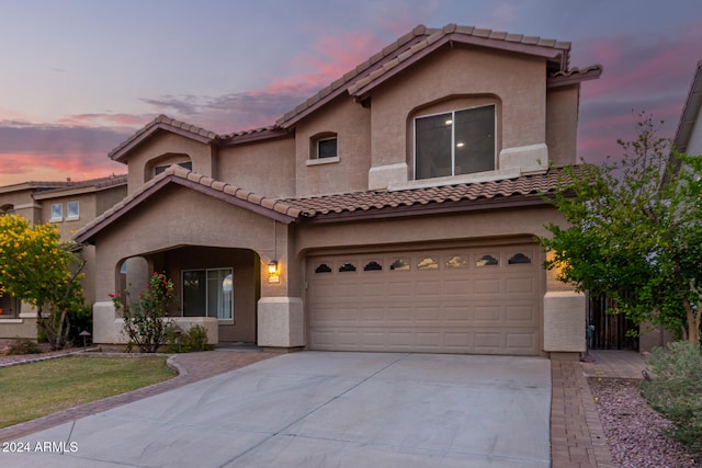 mediterranean / spanish-style home featuring a garage