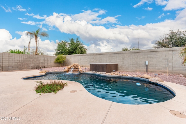 view of swimming pool featuring a patio and pool water feature