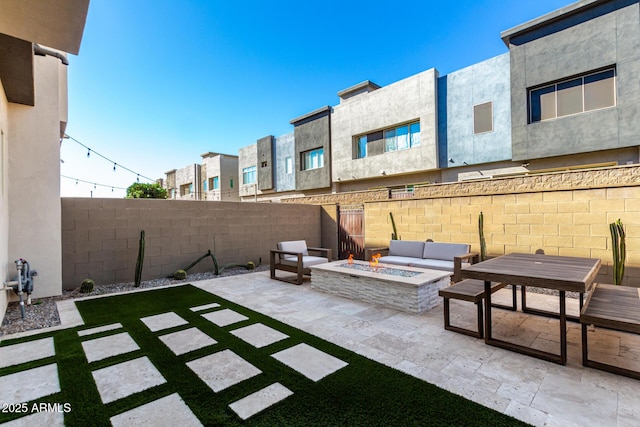 view of patio / terrace with an outdoor fire pit