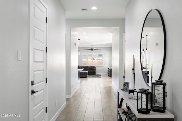 corridor featuring hardwood / wood-style flooring