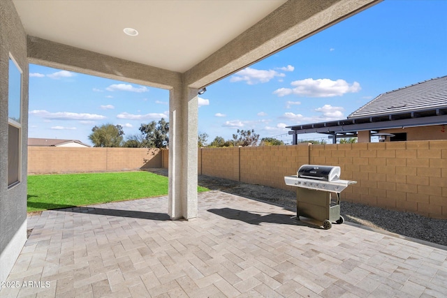 view of patio featuring a grill