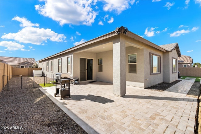 rear view of property with a patio area