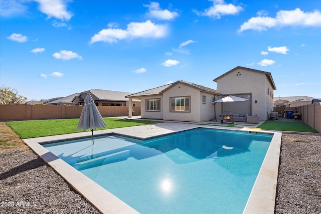 view of pool featuring a patio, a yard, and an outdoor hangout area