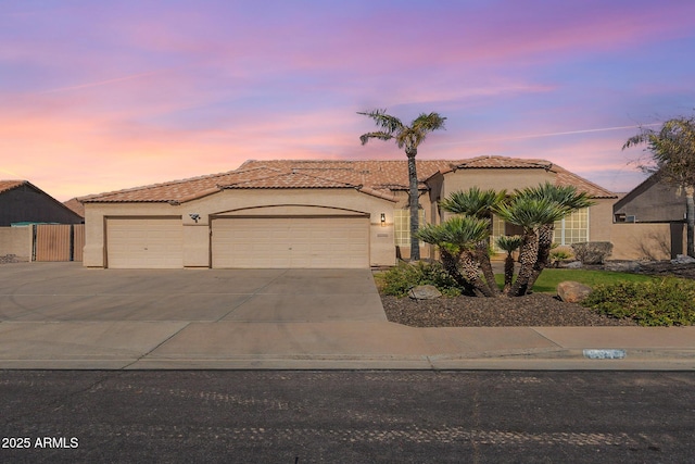 mediterranean / spanish-style home featuring a garage