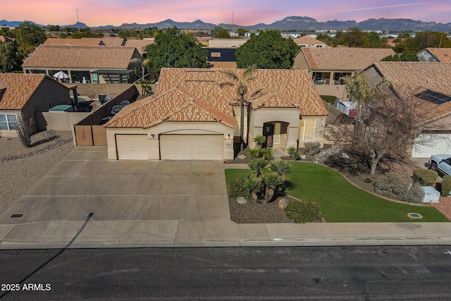 view of front of house featuring a mountain view and a garage