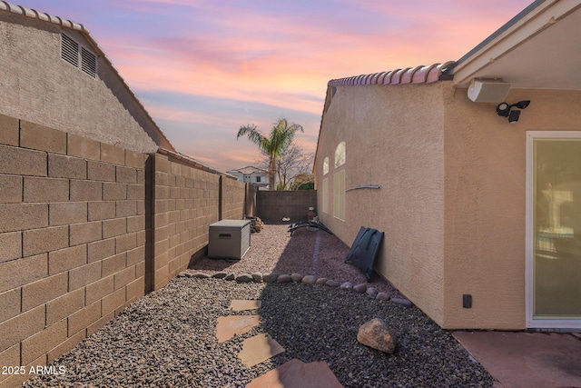 view of property exterior at dusk